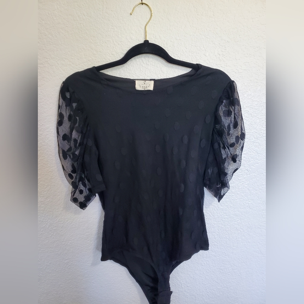 Black polka dot body suit